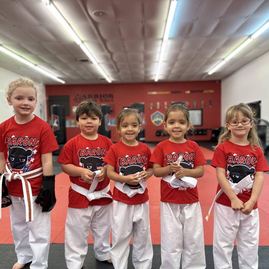 ATA Martial Arts Jonesboro Tiger students smiling wearing uniform.